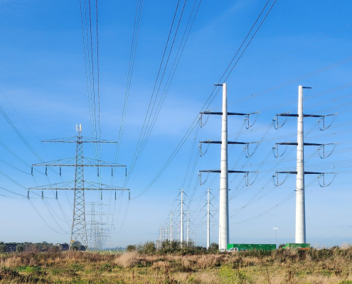 old and new electricity towers